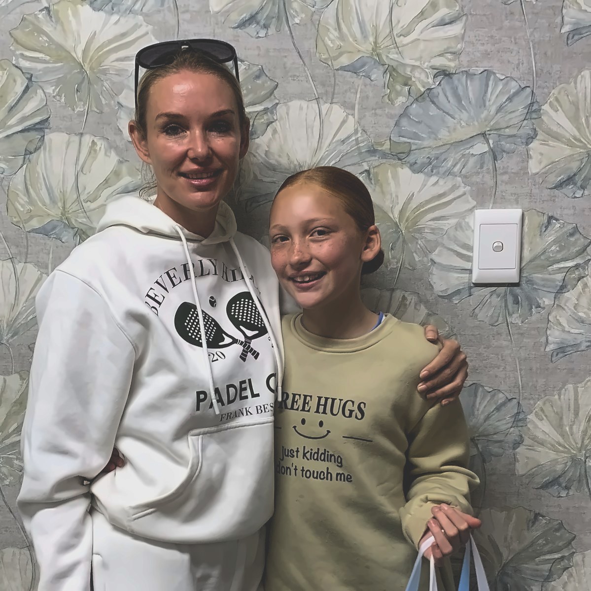 Parent and young patient with a Spark clear aligner gift bag at Lonehill Orthodontics