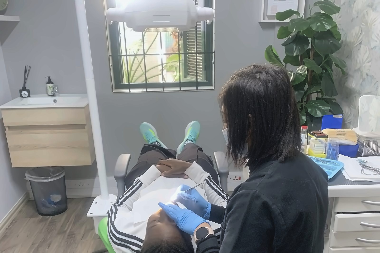 Patient relaxed in the chair in a naturally lit Lonehill Orthodontics treatment room